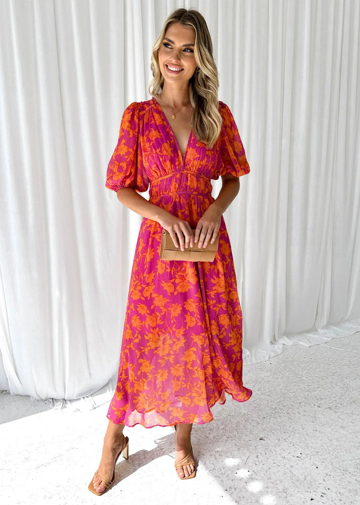 "Women's vibrant pink floral v-neck dress crafted with soft cotton blend, perfect for a casual chic look."