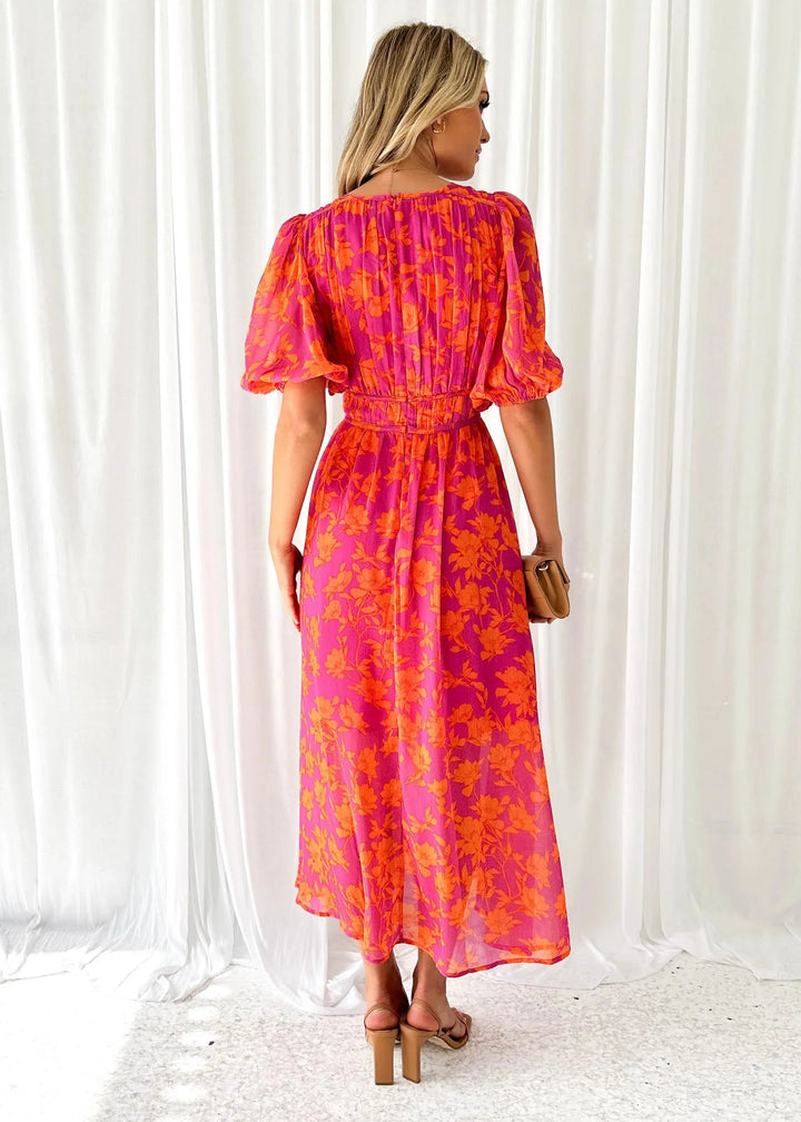 Women’s pink floral v-neck dress with a vibrant design perfect for spring and summer, made from comfortable and breathable…