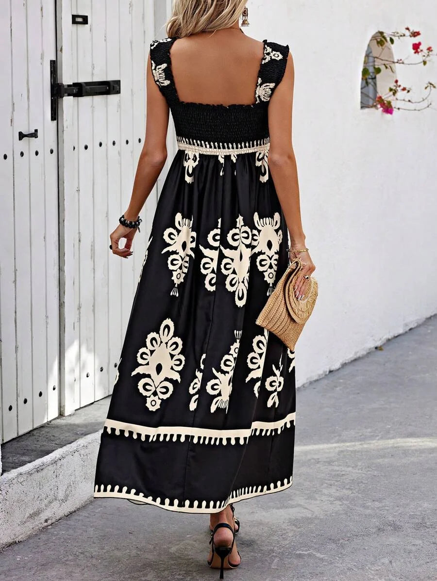 "Sianna Strapless Bohemian Beach Maxi Dress in lightweight patterned fabric with tiered skirt and tie detail."