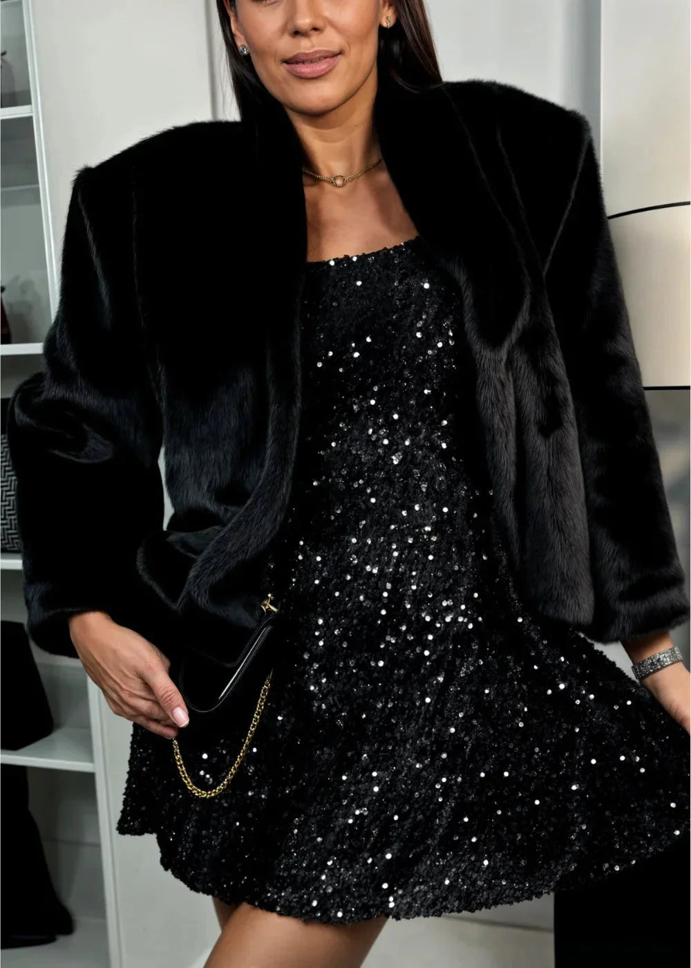 "Black sequined dress with flared sleeves for women, ideal for a glamorous evening look."