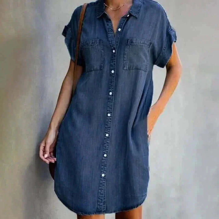 Dark blue casual denim dress with button front, a stylish and versatile wardrobe choice for everyday wear.