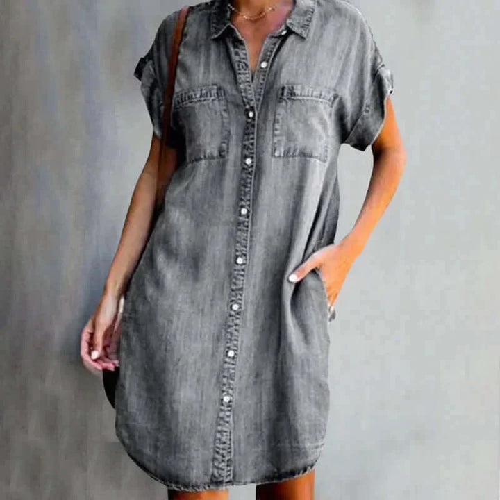 Gray denim dress with button front by Skyy, perfect for casual occasions. Made from high-quality fabric with a stylish and…