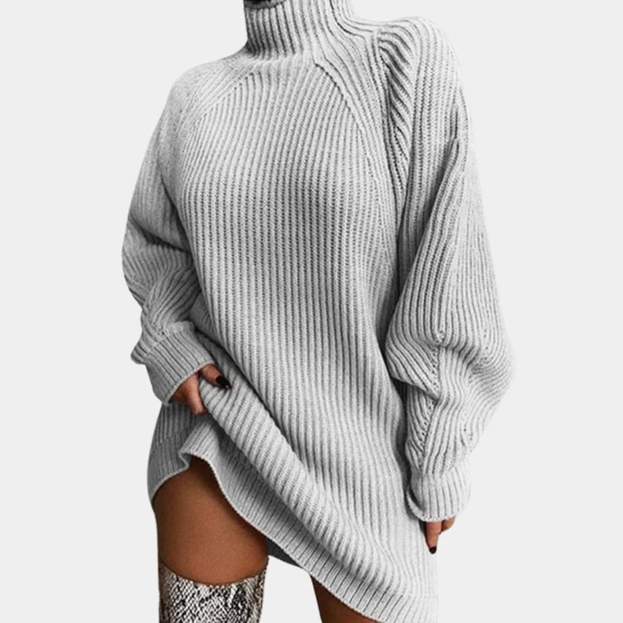 Oversized rib-knit sweater dress in soft, cozy material with a snowy white hue for a versatile winter wardrobe staple.