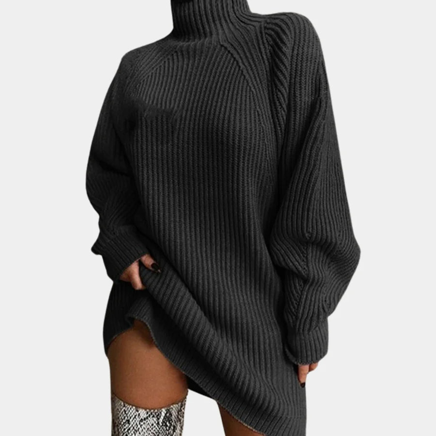 Black rib-knit sweater dress with cozy oversized design, perfect for staying warm and stylish in the snow.