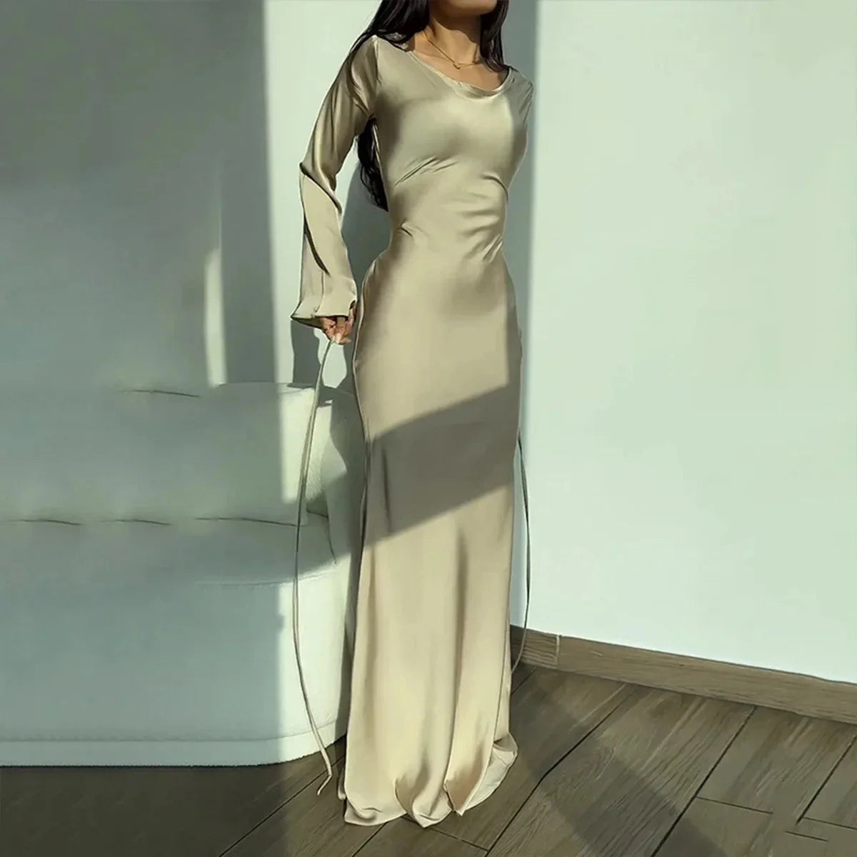 "Apricot satin finish maxi dress, perfect for elegant evening events, featuring a stylish design and high-quality material."