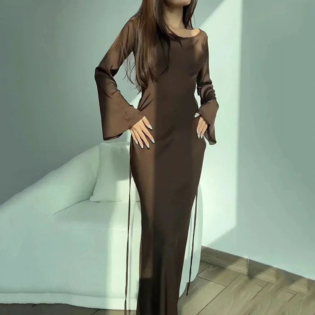 Brown satin finish maxi dress, perfect for evening events. Elegant and sleek design, will make you stand out in style.