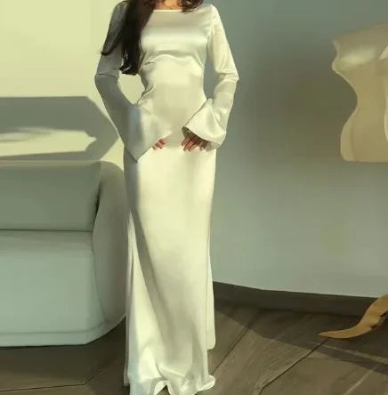 "Satin finish white maxi dress suitable for evening events, featuring a sleek design perfect for stylish occasions."