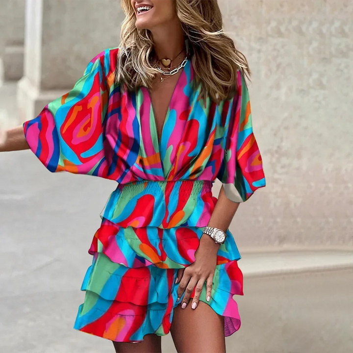 Pink flared sleeve wrap dress for women by Talani, featuring a stylish and vibrant floral print design in a comfortable…