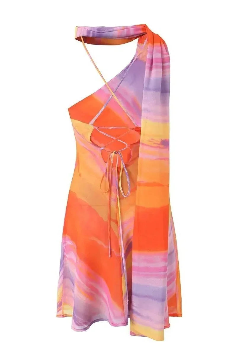 Halter dress in multicolored swirl print for women, featuring a vibrant and eye-catching design.