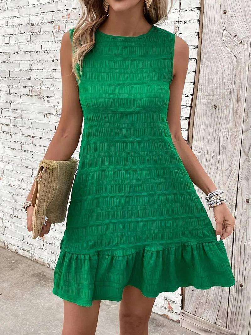 Green pleated sleeveless dress with ruffled hem, perfect for any event. Flowy and elegant, ideal for summer outfits.