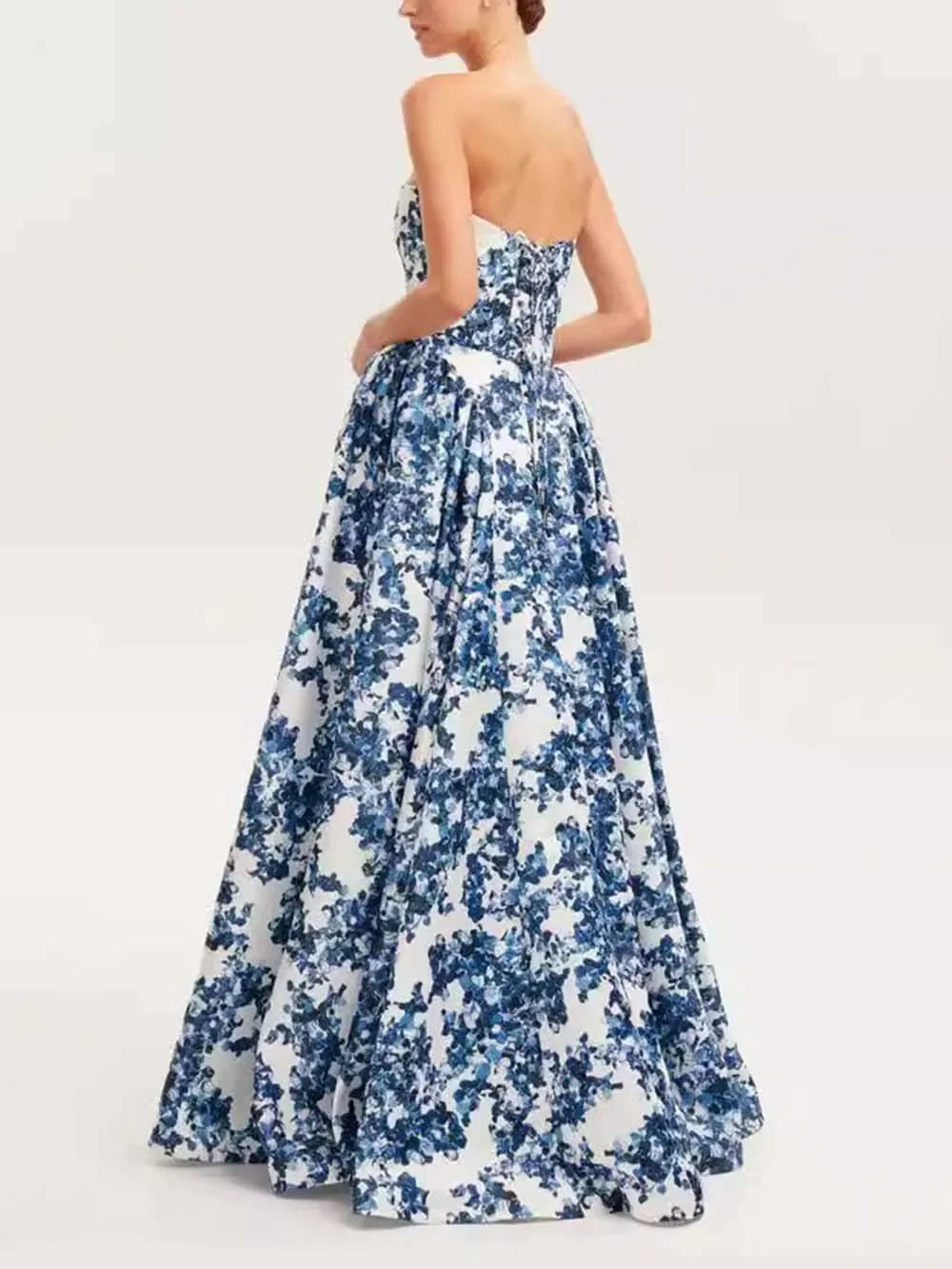 Blue floral strapless maxi dress with lightweight cotton fabric, featuring a vibrant floral pattern ideal for a breezy…