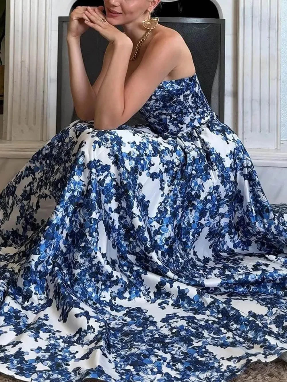 "Blue floral strapless maxi dress with elegant design, perfect for special occasions, crafted from high-quality fabric."