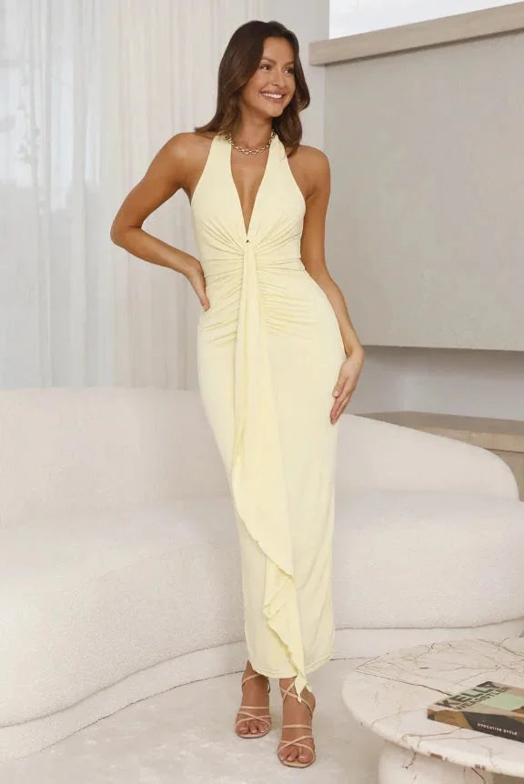 Sleeveless yellow maxi dress made of breathable fabric, includes slimming design for a flattering fit.