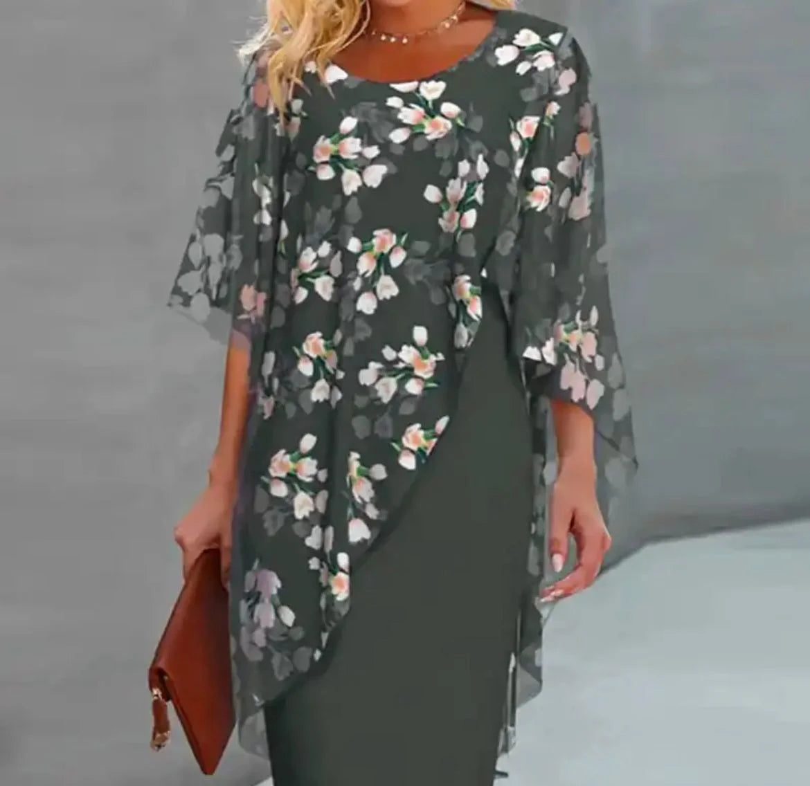 "Knee-length dress with floral chiffon overlay, perfect for an elegant look for any occasion."