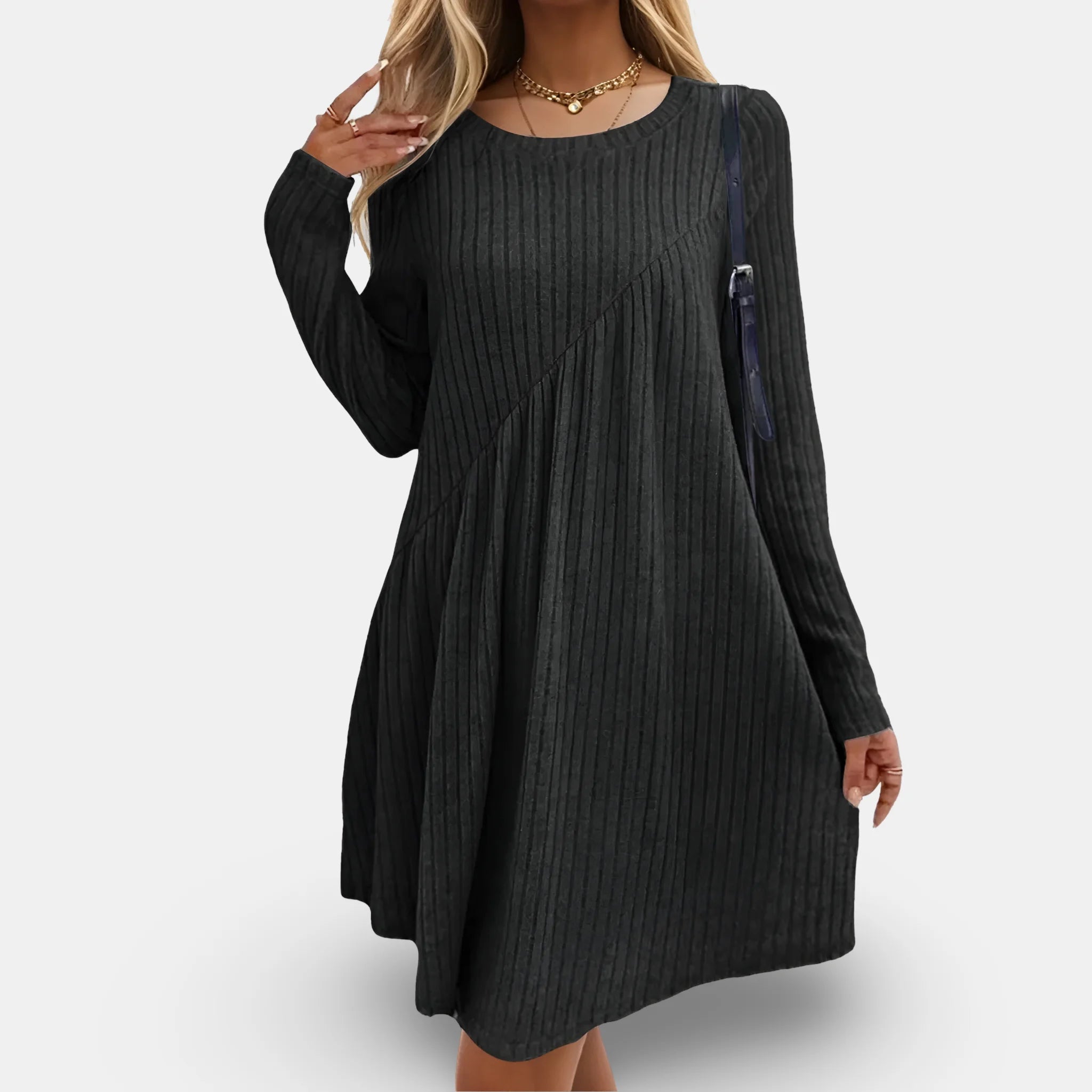 Black flowing dress with textured fabric & long sleeves, ideal for effortless style & comfort.