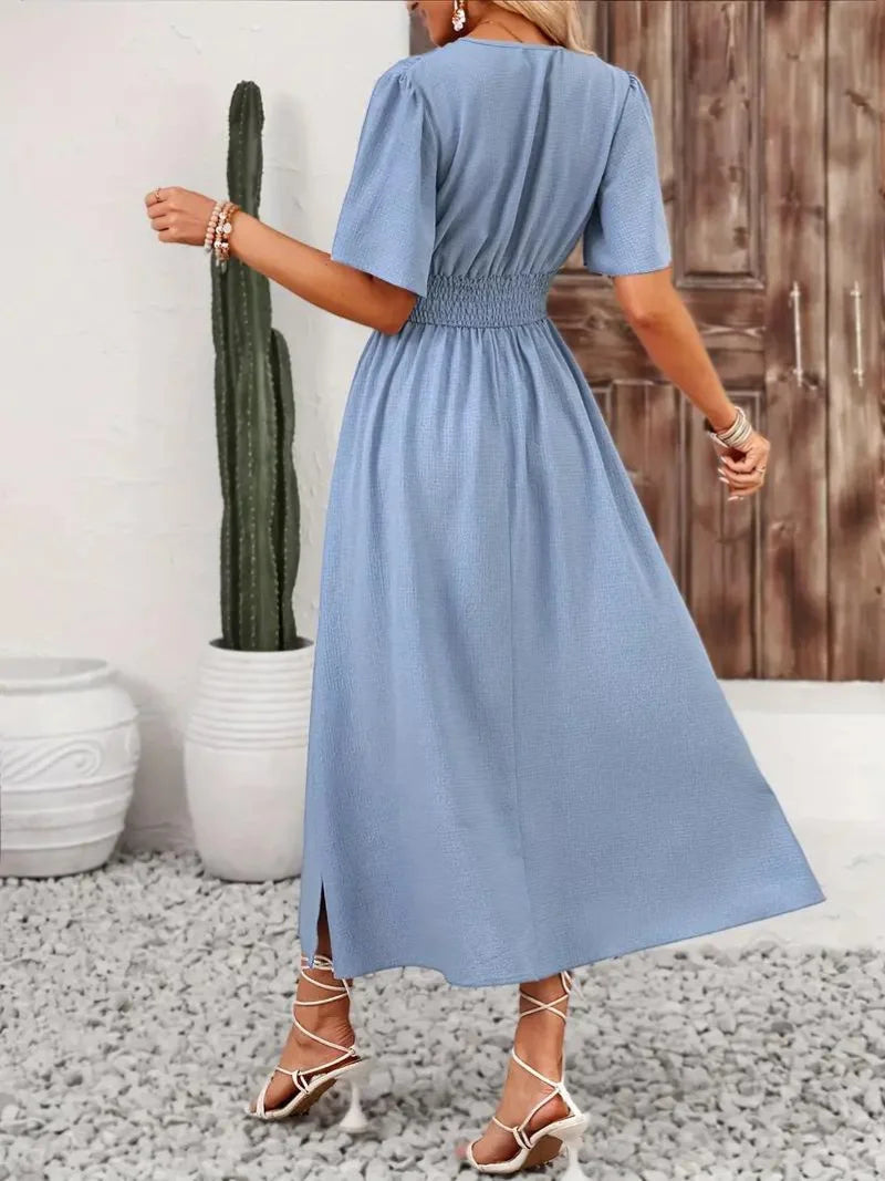 Verity sundress in a flowy, midi design with a stylish V-neck cut, perfect for casual chic summer days.