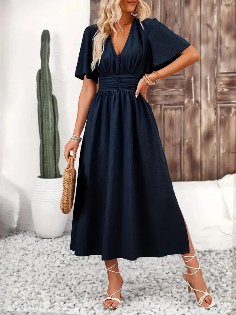 "Verity midi sundress in navy blue with a flowy V-neck design, perfect for casual summer days."