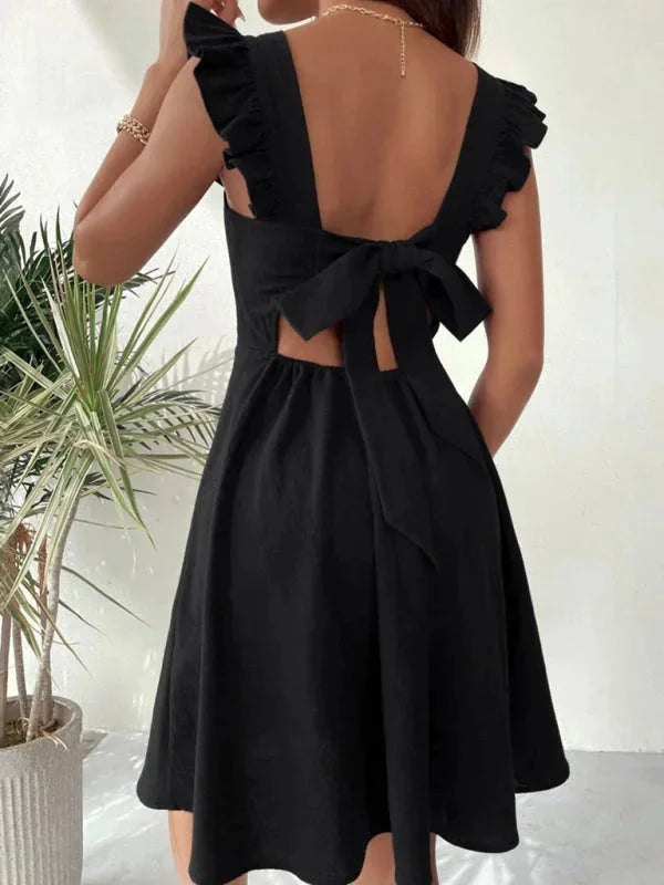 Women's fitted dress with ruffle straps in soft cotton blend. Knee-length with a slim silhouette, perfect for casual outings…