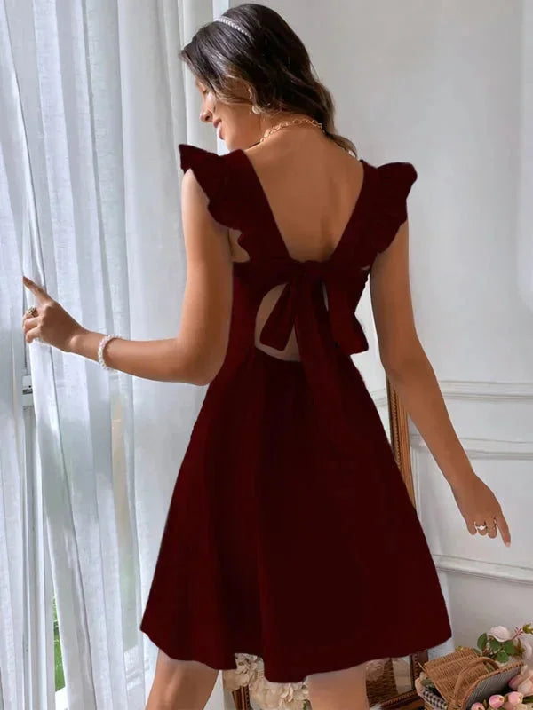 "Women's fitted dress with ruffle straps in a soft cotton blend fabric, perfect for a casual yet stylish look."
