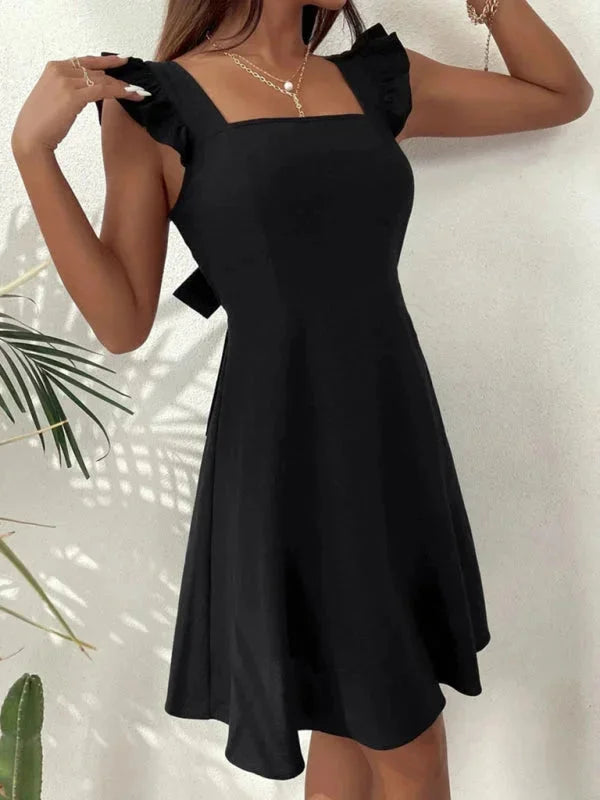 "Black fitted dress for women with ruffle straps, ideal for special occasions and events. Made of soft, stretchy fabric."