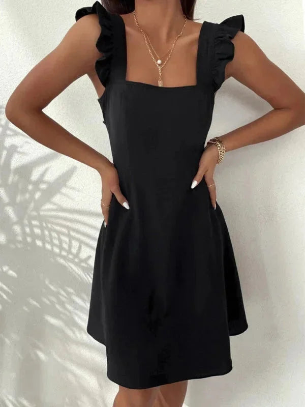 Black women's fitted dress with ruffle straps, made from comfortable stretch fabric. Perfect for a chic and stylish look.