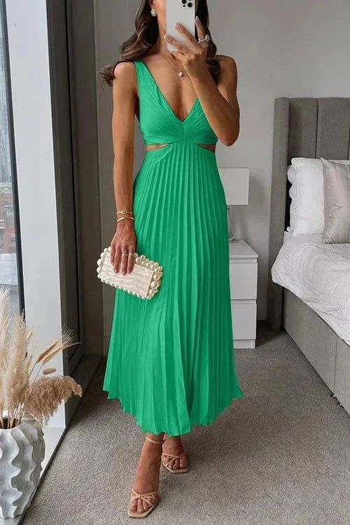 Green pleated dress for women with side cut-outs, made with soft and breathable fabric. Elegant and stylish design for any…