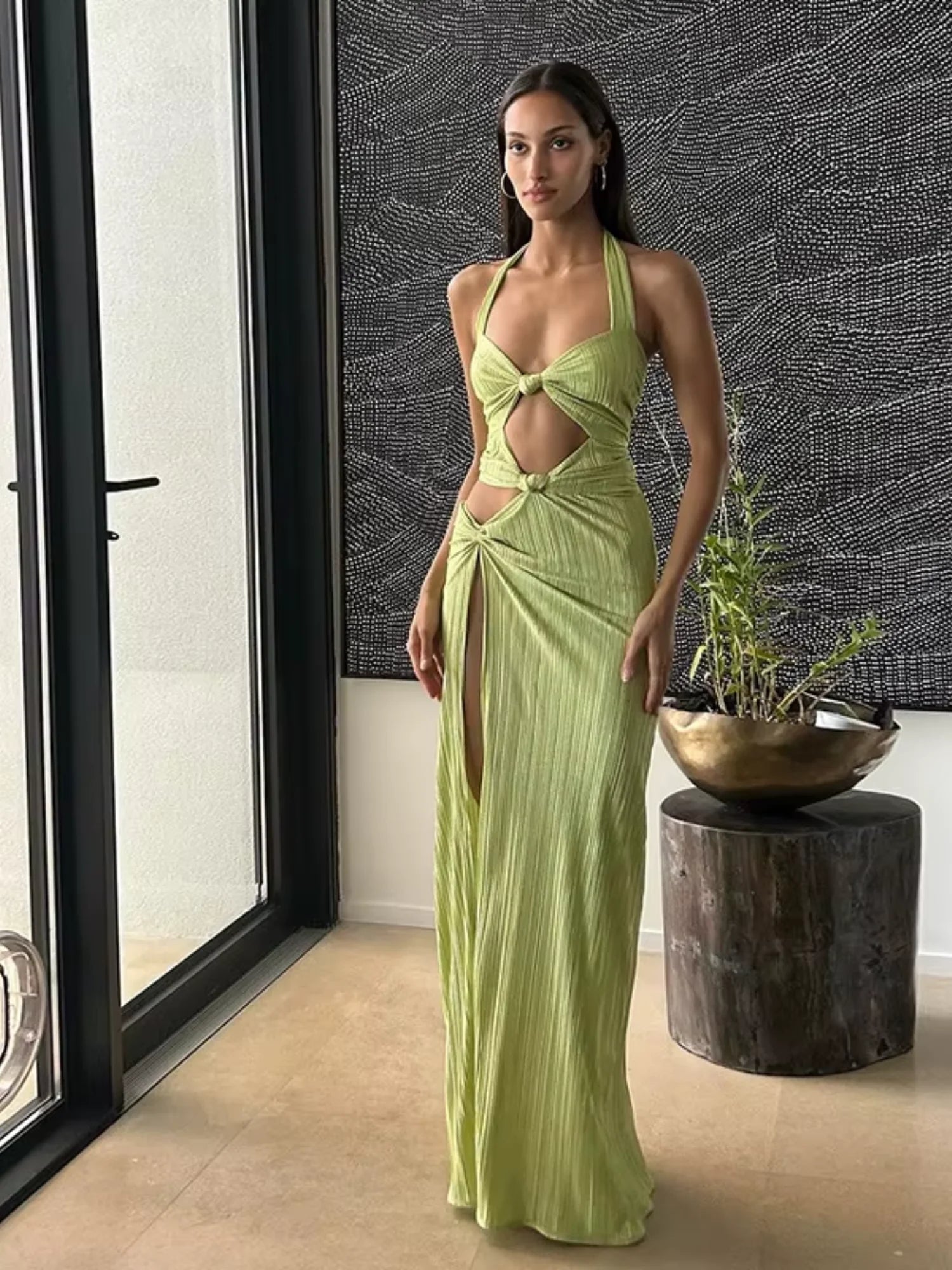 Lime green cut-out maxi dress with elegant design and flattering silhouette, perfect for summer outings and special events.