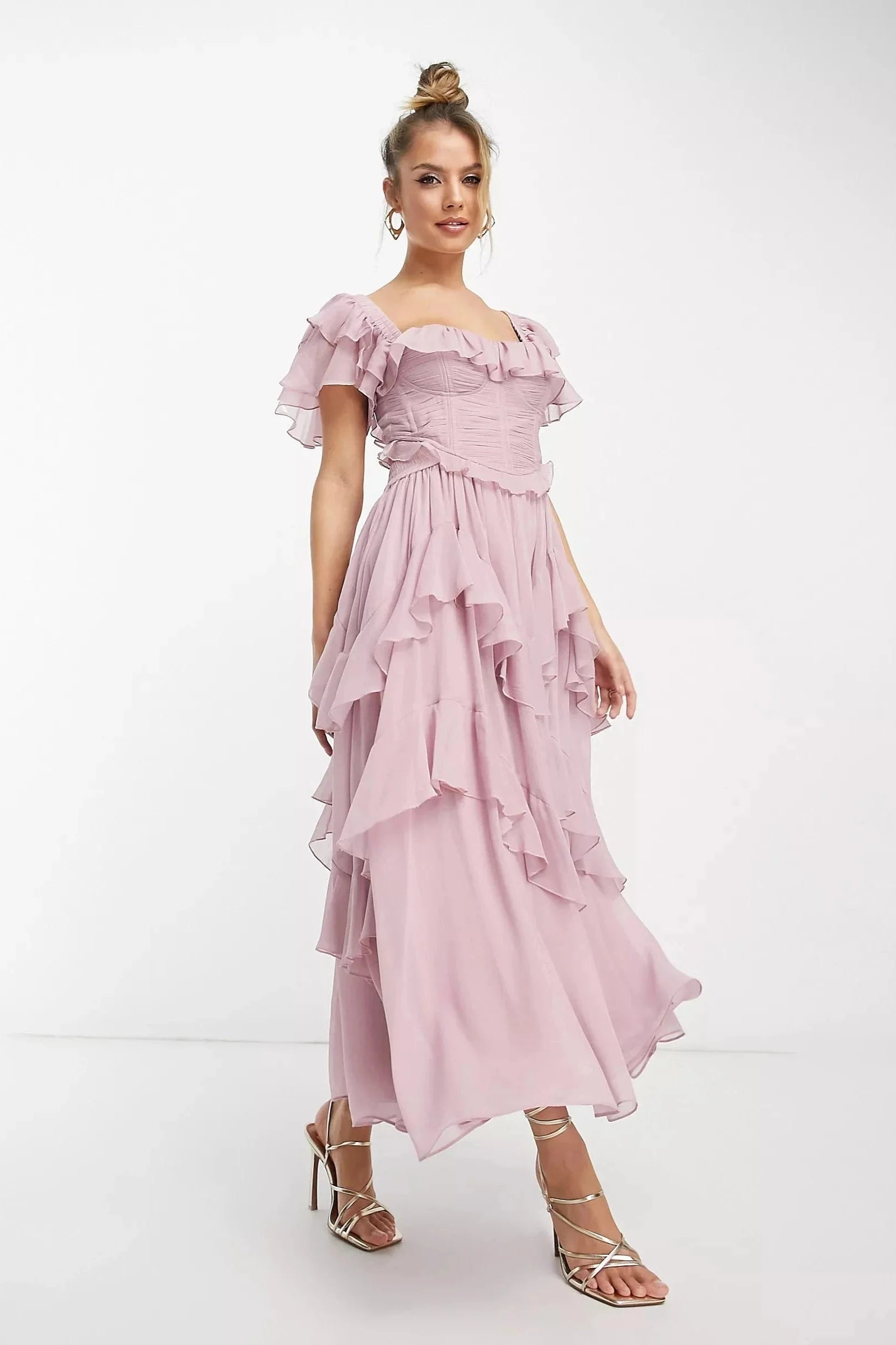 Pink tiered ruffle maxi dress with a flowy design, perfect for casual or formal events. Made from lightweight and breathable…